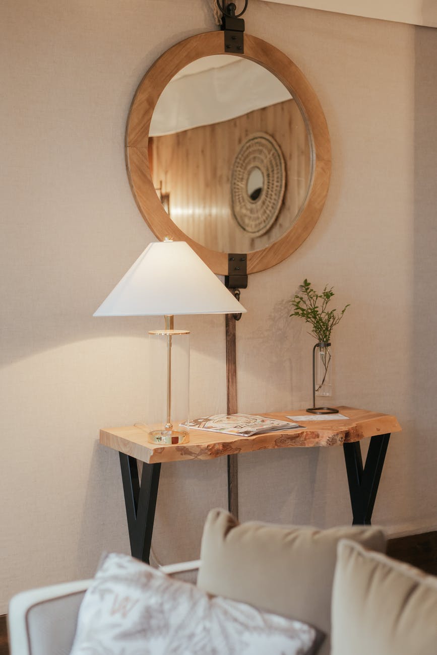 a table lamp on the table with mirror