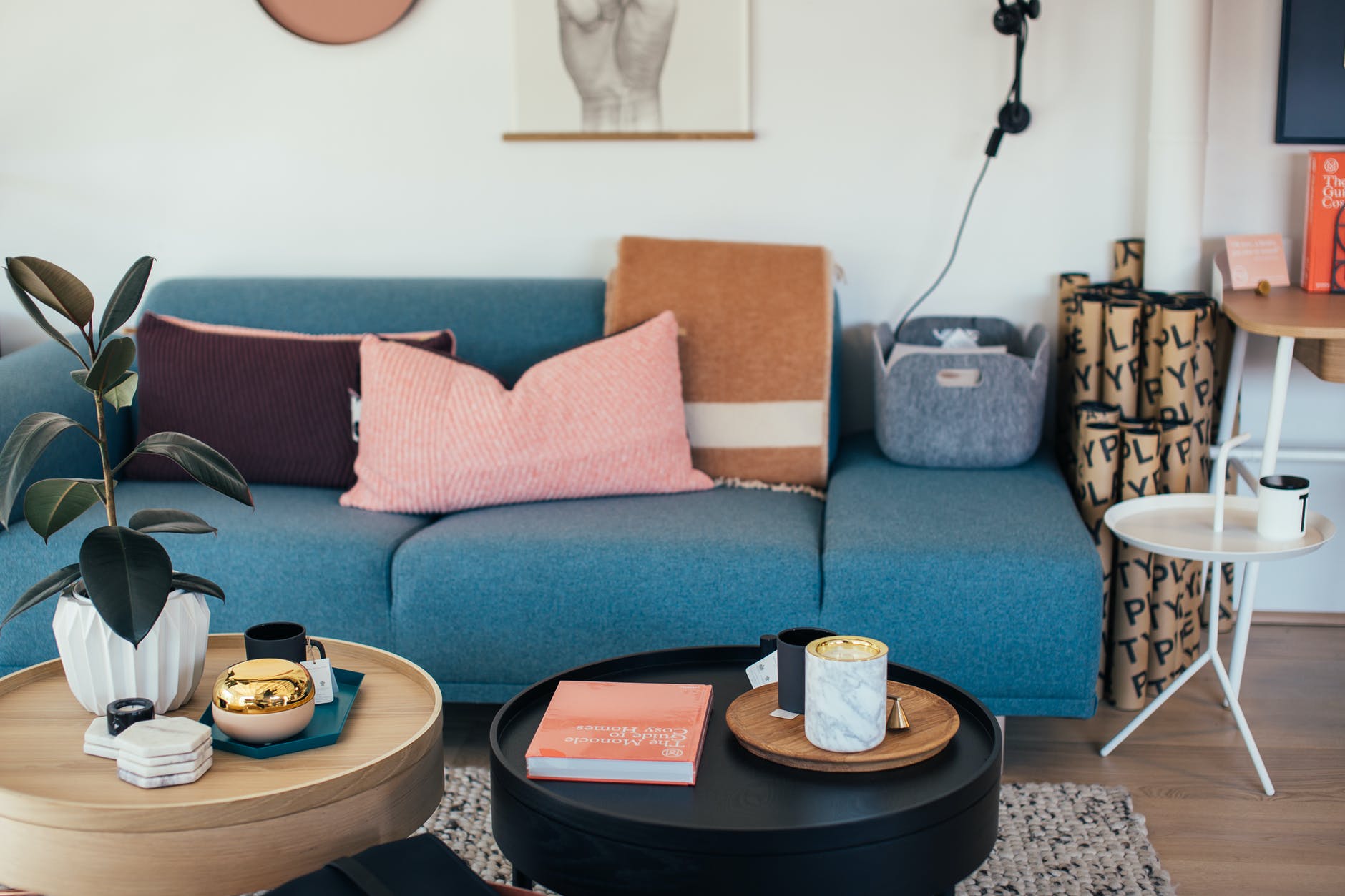 interior of living room with cozy couch and round coffee tables