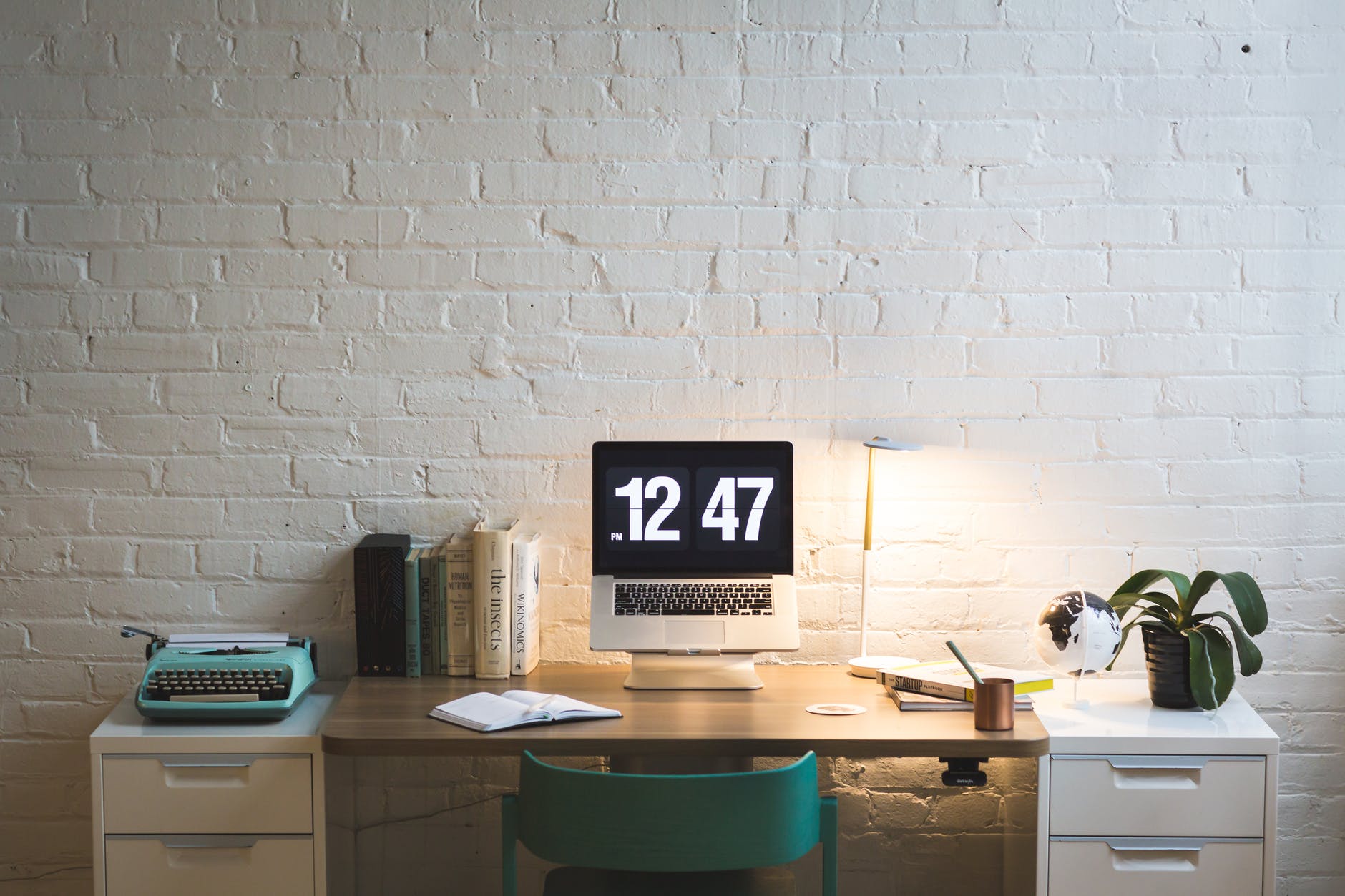 silver and black digital alarm clock on table for small home office