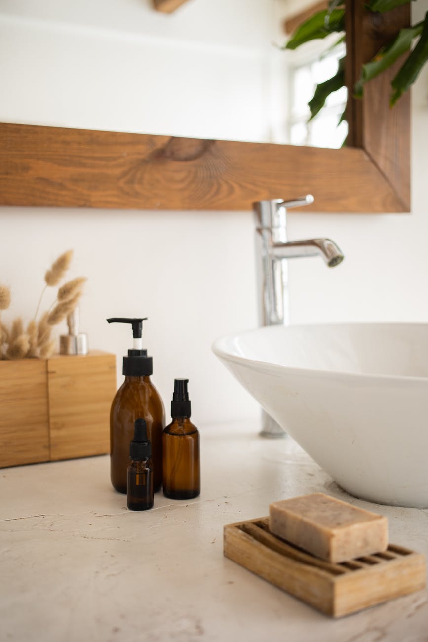 sink with skincare products in bathroom