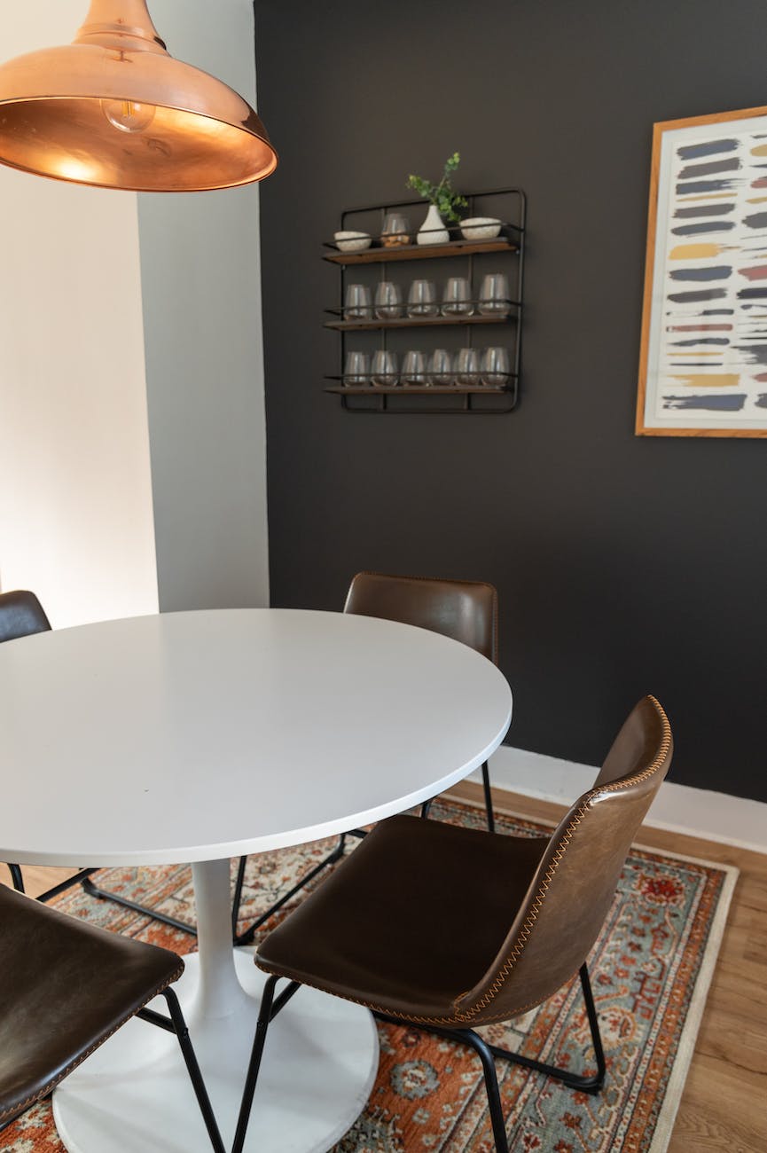 round white wooden table with chairs